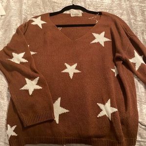 Brown sweater with white stars